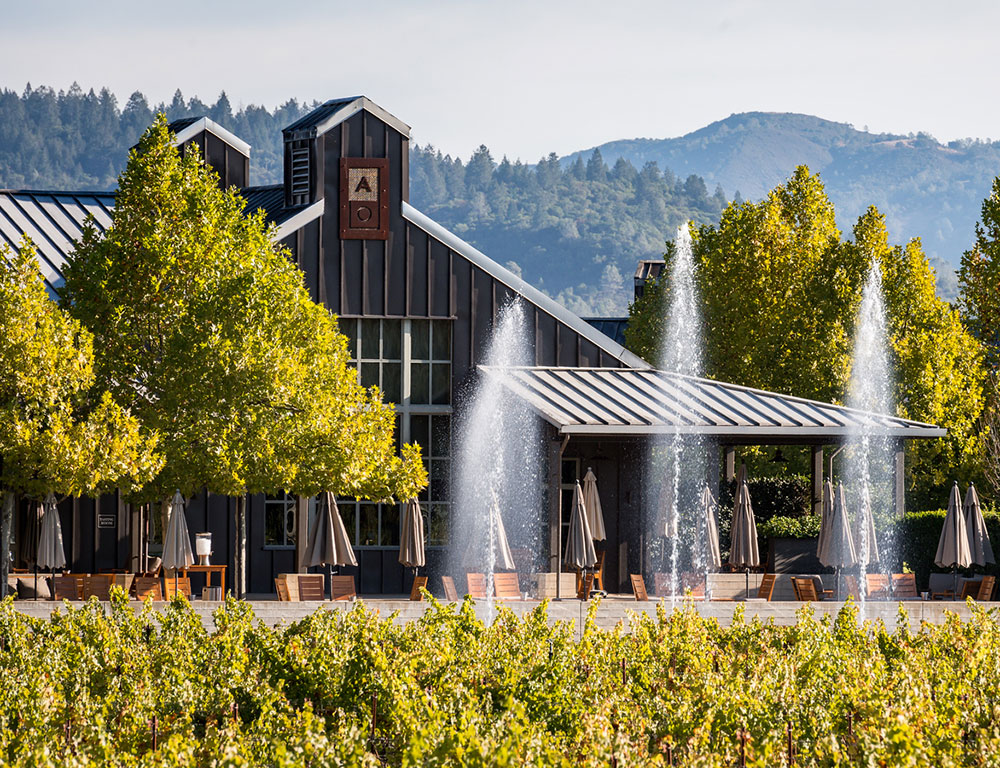 View of Alpha Omega Tasting Room with fountains out front